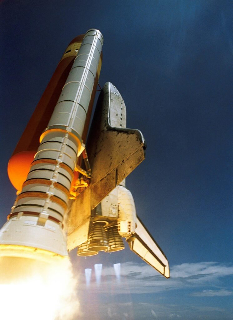 space-shuttle-start-discovery-spaceport-87080-87080 Dynamic low angle view of a space shuttle launch highlighting rocket boosters igniting for space travel.